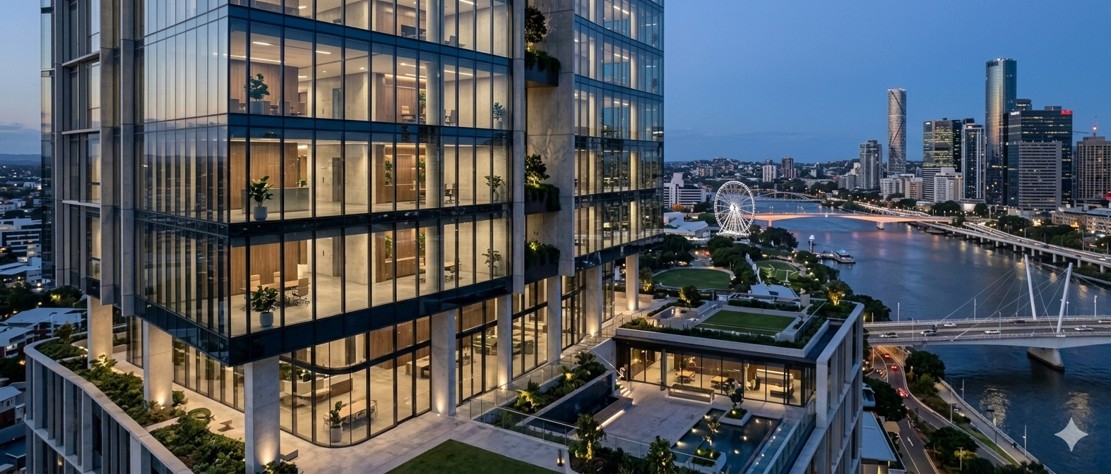 Modern commercial building overlooking Brisbane river at dusk